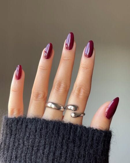 Classic maroon almond nails with high gloss finish
