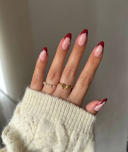 Red French tip nails with pearl cuticle detail