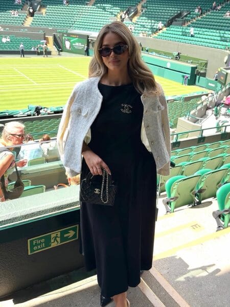 Black midi dress with cream tweed jacket for an elegant Wimbledon outfit.