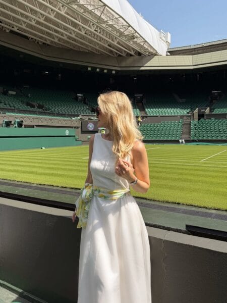 Ivory halter gown with citrus print sash for a summer Wimbledon outfit.