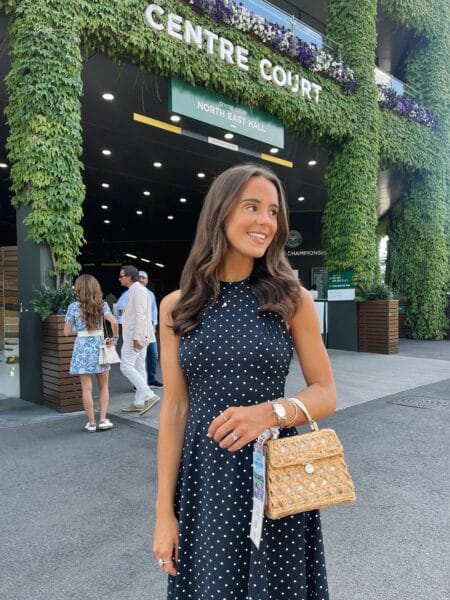 Navy polka dot halter midi dress for a timeless Wimbledon outfit.