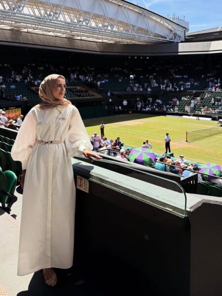 Cream belted kaftan dress with hijab for an elegant Wimbledon outfit.