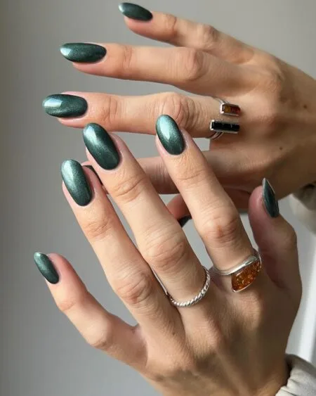 Forest green glossy nails with a rich botanical-inspired colour.