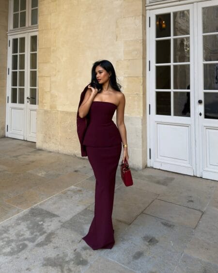 Strapless burgundy peplum top and column skirt with a blazer, a burgundy fall wedding guest outfit