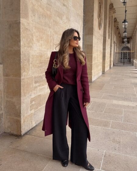 Burgundy wool coat over a matching knit with black wide-leg trousers, an old money burgundy fall outfit