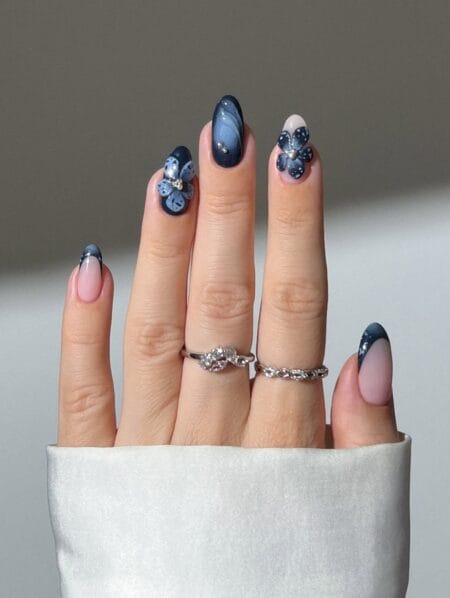 Navy blue marble nails with pale blue flower art