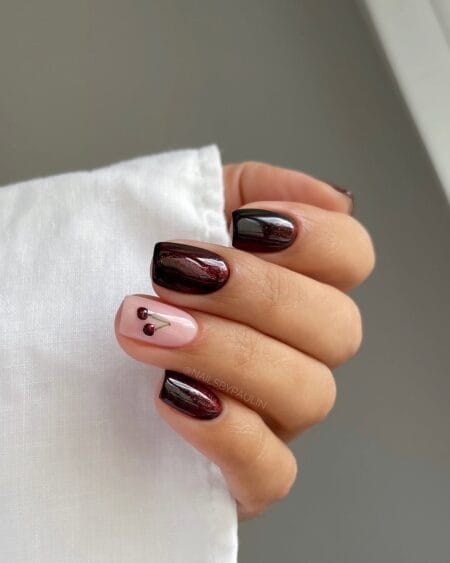 Dark cherry and ruby glitter squoval nails with cherry motif