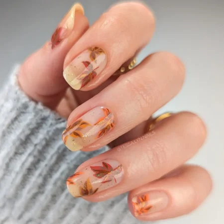 Falling autumn leaves negative space nails in rust and gold