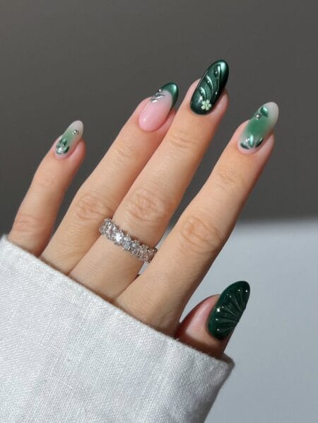 Emerald green floral French almond nails with gems