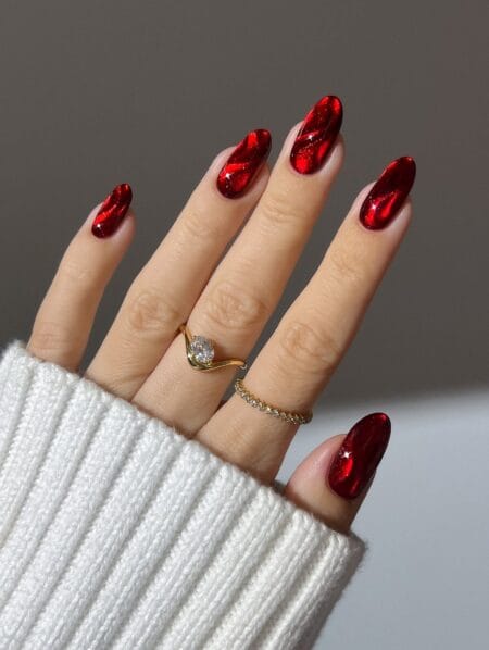 Glossy red cat eye almond nails
