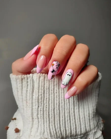 Milky pink nails with ghost candy corn and spider web halloween nails