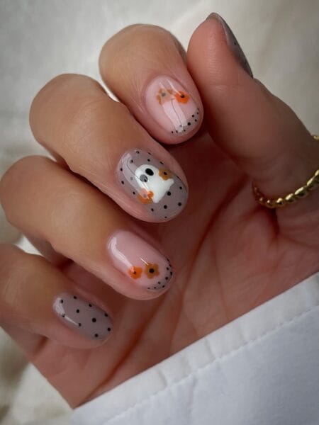 Sheer grey nails with polka dots flowers and white ghost
