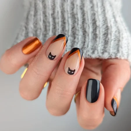 Orange chrome and black nails with black cat face halloween nails