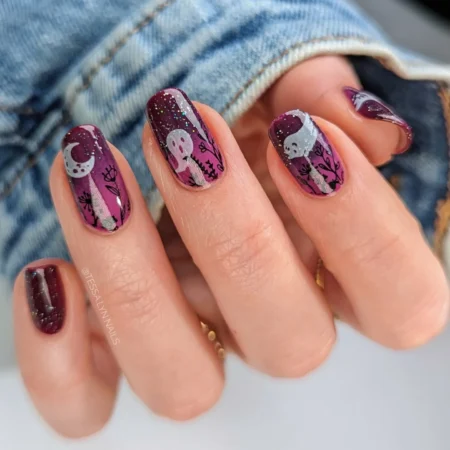 Deep berry nails with silver ghosts moons and florals