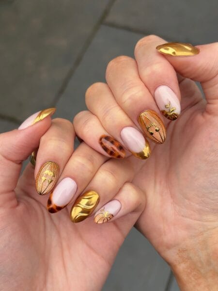 Nude tortoiseshell and gold chrome pumpkin halloween nails