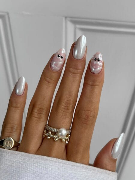 Pearl white chrome nails with pink mummy halloween nails