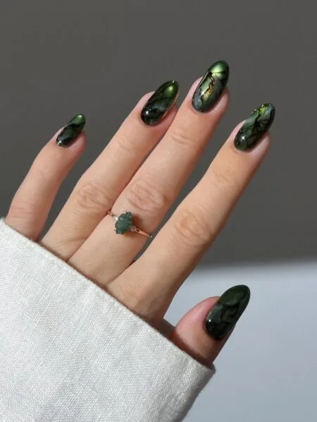 Forest green glossy nails with a rich botanical-inspired colour.