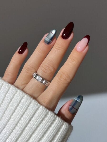 Brown and beige plaid nail art on almond-shaped nails.