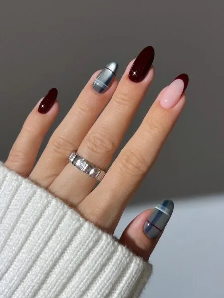 Brown and beige plaid nail art on almond-shaped nails.