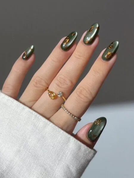 Forest green glossy nails with a rich botanical-inspired colour.