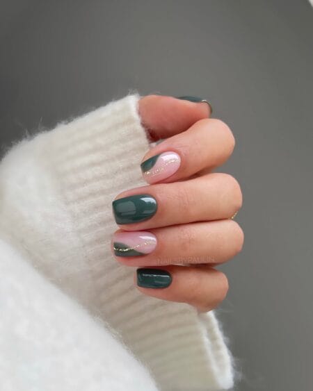 Short square nails in forest green with a thin gold glitter line