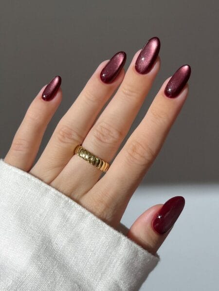 Long almond nails in burgundy velvet magnetic polish
