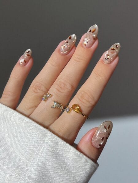 Sheer pearl chrome nails with copper foil autumn leaves