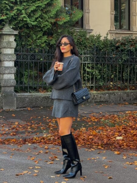 October outfit with grey knit skirt set and tall black leather knee boots