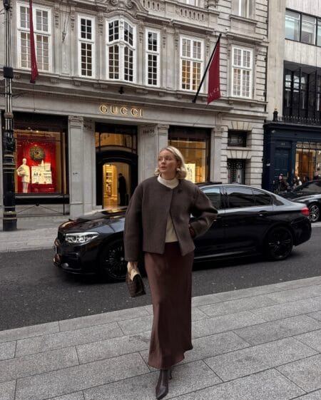 October outfit with brown boxy wool jacket, cream knit and chocolate satin slip skirt