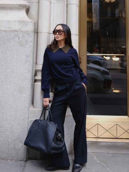 October work outfit with navy collared knit and navy pleated wide-leg trousers