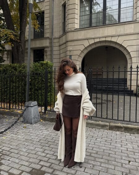 October outfit with long ivory maxi cardigan, cream roll-neck and brown suede mini skirt