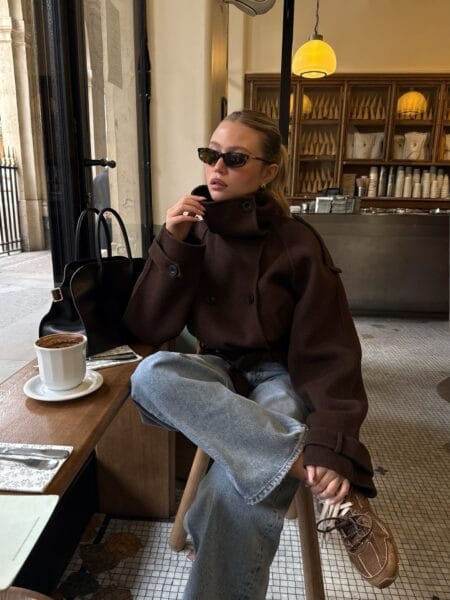 Casual fall outfit with cropped brown funnel-neck jacket and light-wash wide-leg jeans