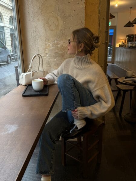 October outfit with chunky cream roll-neck jumper, straight jeans, ribbed socks and loafers