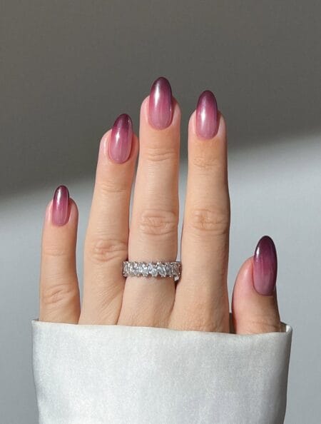 Mauve chrome almond nails with a berry-to-pearl ombre finish