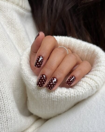 Dark chocolate brown short nails with pale pink polka dots