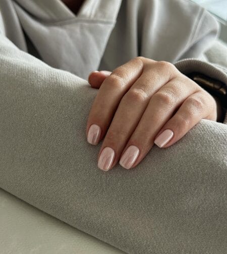 Sheer glazed pink short nails with a wet-look natural finish