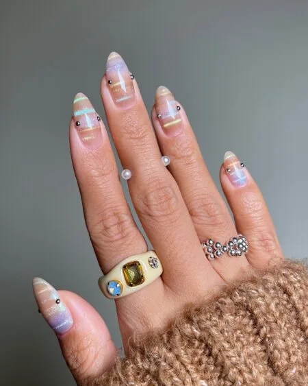 Brown and beige plaid nail art on almond-shaped nails.