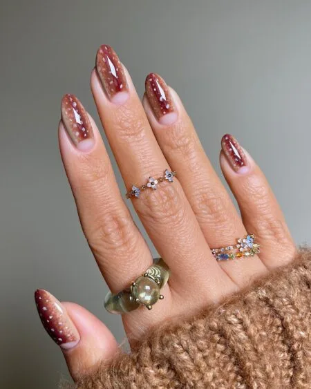Deep burgundy velvet cat eye nails with a magnetic shimmer.