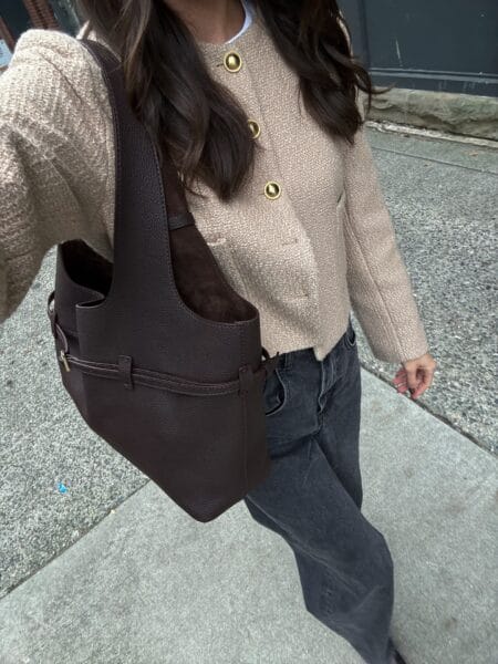 Cropped oatmeal boucle jacket with gold buttons, white tee and washed black straight-leg jeans