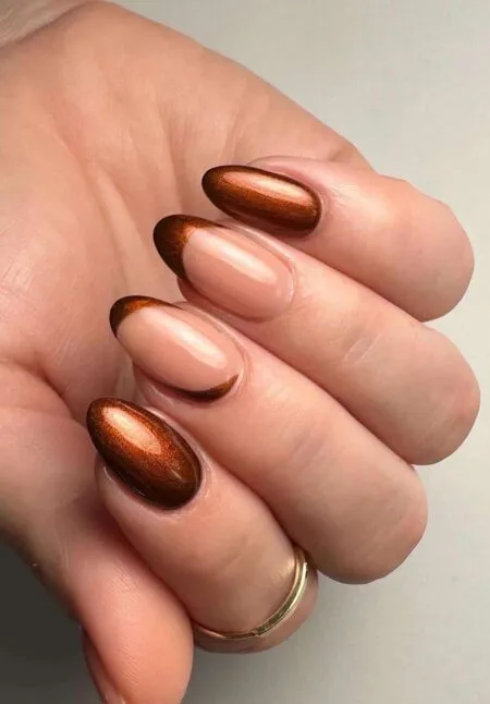 Copper metallic nails with a reflective chrome finish.