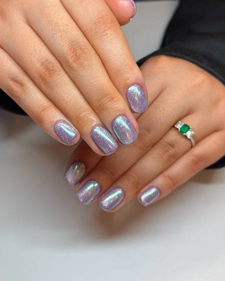 Lilac chrome shimmer squoval nails with soft iridescent reflections