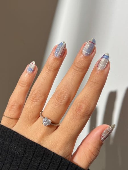 Champagne cat-eye magnetic shimmer nails paired with soft blue and red tartan plaid art