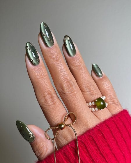 Olive green velvet magnetic nails detailed with raised 3D molten gold branch motifs