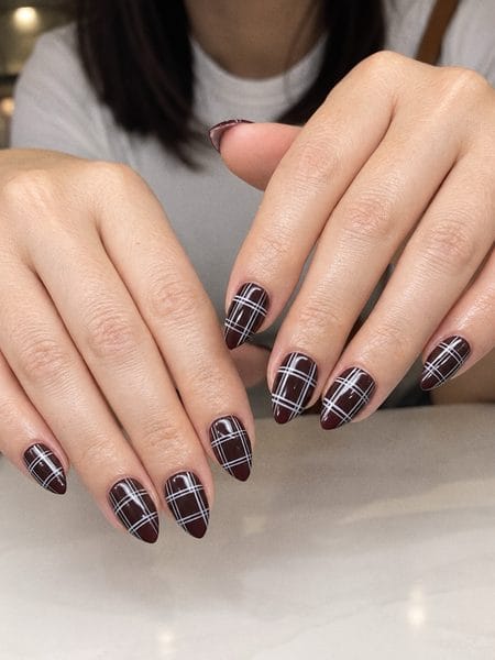 Dark mocha almond nails with fine white tartan plaid lines
