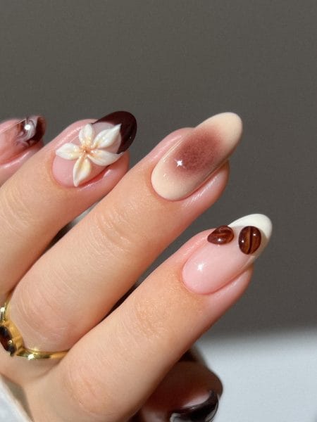 Latte-inspired nails with 3D cream flowers and tiny coffee bean accents