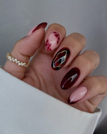 Bordeaux jelly nails with tortoiseshell accent and molten gold frame