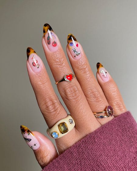 Almond nails with tortoiseshell French tips and colourful miniature artwork