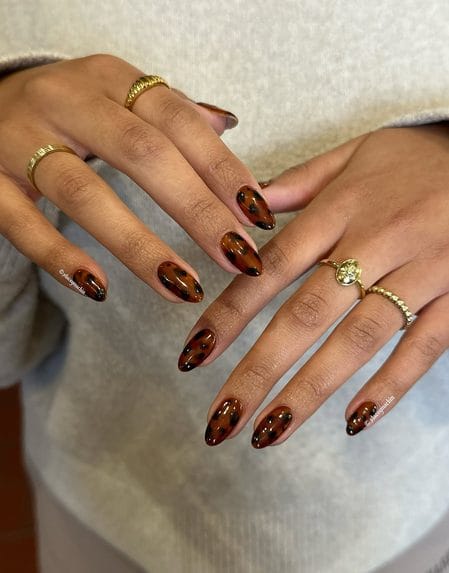 Full honey amber tortoiseshell glaze on glossy oval nails